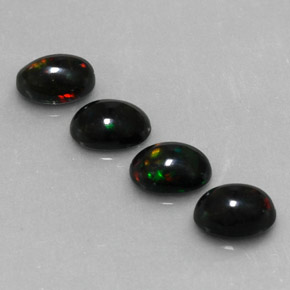 Gemas de ópalo negro multicolor natural de  ct, corte óvalo, opaco