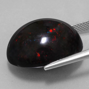 Ópalo negro multicolor natural de 20,04 ct, corte óvalo, opaco