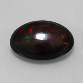 Ópalo negro multicolor natural de 7,87 ct, corte óvalo, opaco