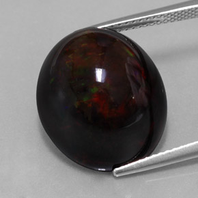 Ópalo negro multicolor natural de 13,63 ct, corte óvalo, opaco