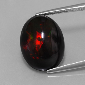Ópalo negro multicolor natural de 8,11 ct, corte óvalo, opaco