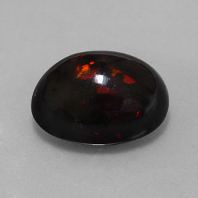Ópalo negro multicolor natural de 8,11 ct, corte óvalo, opaco