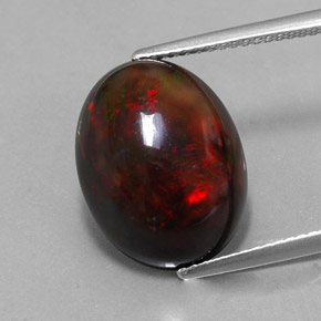 Ópalo negro multicolor natural de 6,26 ct, corte óvalo, opaco