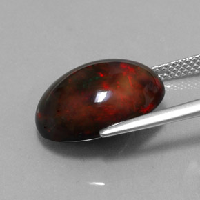 Ópalo negro multicolor natural de 6,26 ct, corte óvalo, opaco