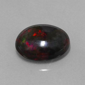 Ópalo negro multicolor natural de 5,81 ct, corte óvalo, opaco
