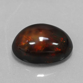 Ópalo negro multicolor natural de 6,02 ct, corte óvalo, opaco