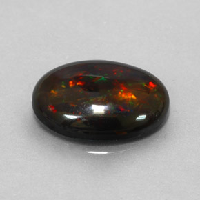 Ópalo negro multicolor natural de 3,17 ct, corte óvalo, opaco