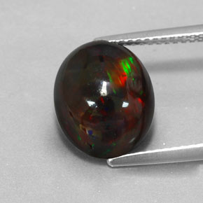 Ópalo negro multicolor natural de 3,84 ct, corte óvalo, opaco