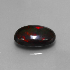 Ópalo negro multicolor natural de 3,80 ct, corte óvalo, opaco