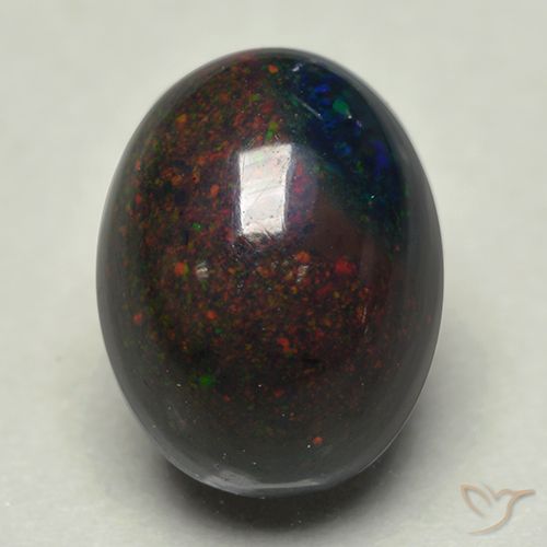 Ópalo negro multicolor natural de 0,74 ct, corte óvalo, opaco