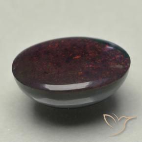 Ópalo negro multicolor natural de 0,74 ct, corte óvalo, opaco