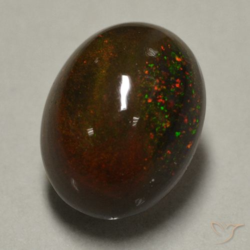 Ópalo negro multicolor natural de 0,89 ct, corte óvalo, opaco