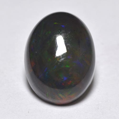 Ópalo negro multicolor natural de 1,33 ct, corte óvalo, translúcido