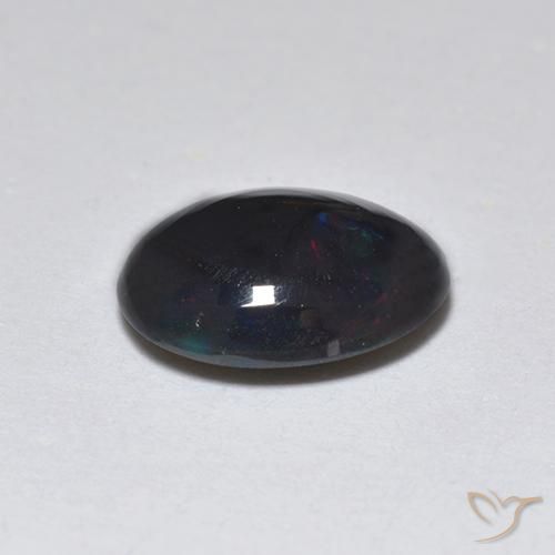 Ópalo negro Multicolor natural de 0.74 ct, Ovalada, Translúcido