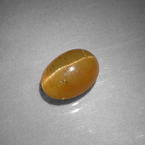 Apatita ojo de gato naranja natural de 1,43 ct, corte óvalo, translúcido