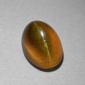 Apatita Ojo de Gato Dorado verdoso natural de 6.55 ct, Corte Óvalo, Translúcido