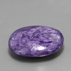 Charoíta violeta natural de 26,05 ct, corte óvalo, opaco