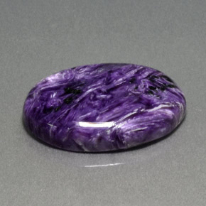 Charoíta violeta natural de 13,86 ct, corte óvalo, opaco