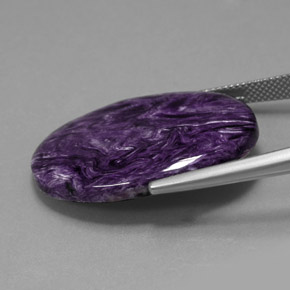 Charoíta violeta natural de 23,69 ct, corte óvalo, opaco