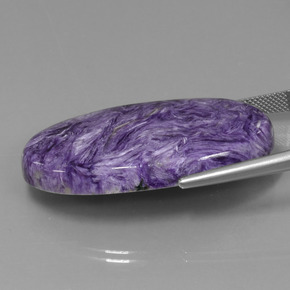 Charoíta violeta natural de 52,34 ct, corte óvalo, opaco