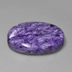 Charoíta violeta natural de 107,30 ct, corte óvalo, opaco