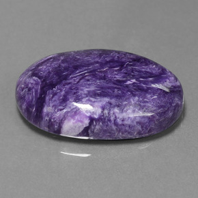 Charoíta violeta natural de 22,21 ct, corte óvalo, opaco