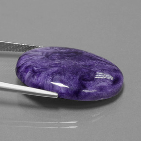 Charoíta violeta natural de 26,43 ct, corte óvalo, opaco