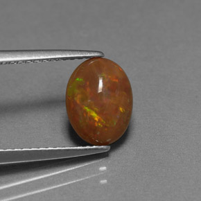 Ópalo chocolate multicolor natural de 0,83 ct, corte óvalo, opaco