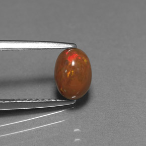 Ópalo de chocolate Multicolor natural de 0.69 ct, Corte Óvalo, Opaco