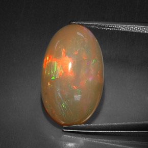Ópalo chocolate multicolor natural de 10,52 ct, corte óvalo, opaco