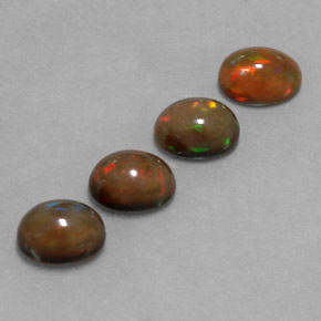 Gemas de ópalo chocolate multicolor natural de 4,20 ct, corte óvalo, translúcido