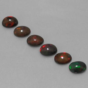 Gemas de ópalo chocolate multicolor natural de 4,61 ct, corte óvalo, translúcido