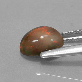 Ópalo chocolate multicolor natural de 0,69 ct, corte óvalo, translúcido