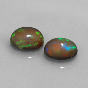 Gemas de ópalo chocolate multicolor natural de  ct, corte óvalo, translúcido