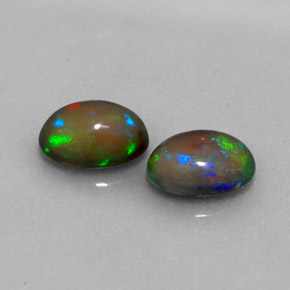 Gemas de ópalo chocolate multicolor natural de  ct, corte óvalo, translúcido