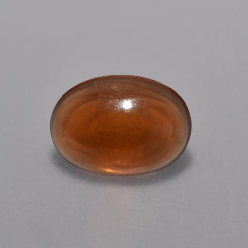 Ópalo chocolate naranja natural de 0,36 ct, corte óvalo, transparente