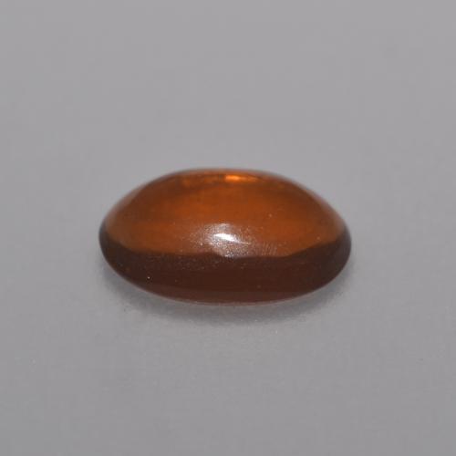 Ópalo chocolate naranja natural de 0,36 ct, corte óvalo, transparente