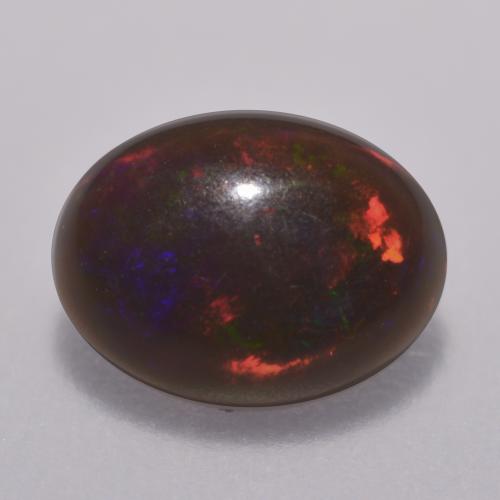 Ópalo chocolate multicolor natural de 0,67 ct, corte óvalo, translúcido