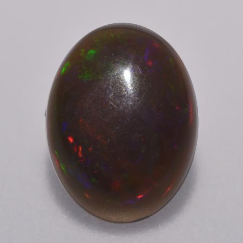 Ópalo chocolate multicolor natural de 0,67 ct, corte óvalo, translúcido