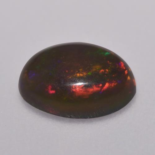 Ópalo chocolate multicolor natural de 0,67 ct, corte óvalo, translúcido