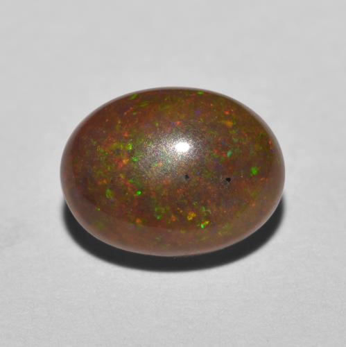 Ópalo chocolate multicolor natural de 0,85 ct, corte óvalo, translúcido