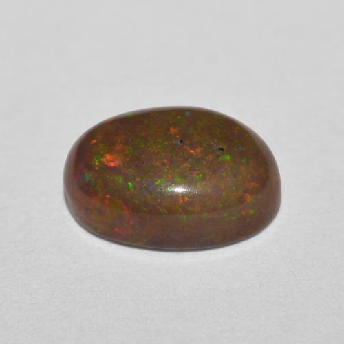 Ópalo chocolate multicolor natural de 0,85 ct, corte óvalo, translúcido