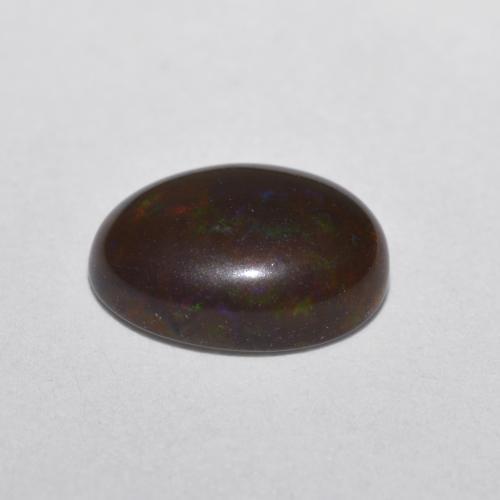 Ópalo chocolate multicolor natural de 0,52 ct, corte óvalo, translúcido