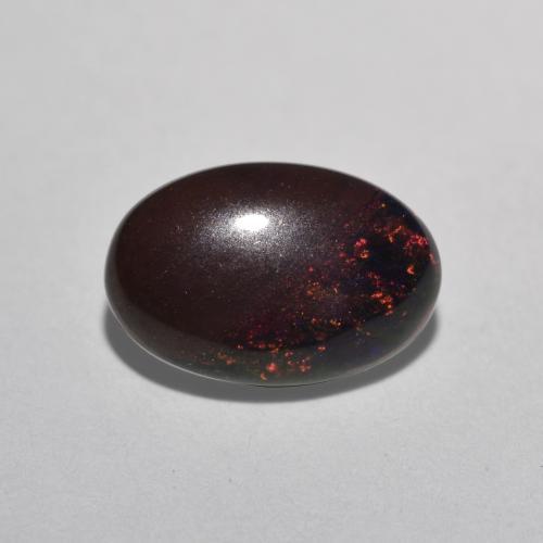 Ópalo chocolate multicolor natural de 0,80 ct, corte óvalo, translúcido