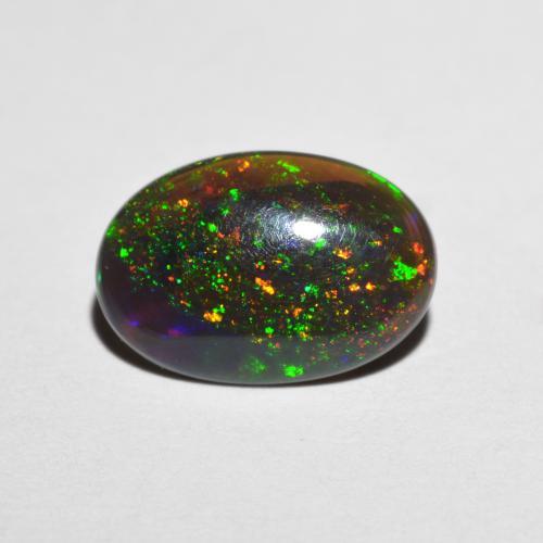 Ópalo chocolate multicolor natural de 0,98 ct, corte óvalo, translúcido