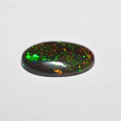 Ópalo chocolate multicolor natural de 0,98 ct, corte óvalo, translúcido