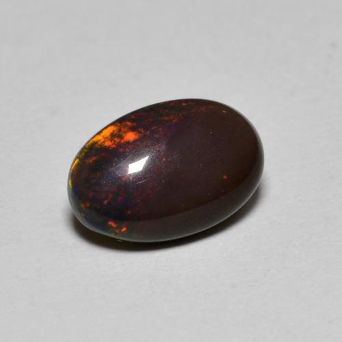 Ópalo chocolate multicolor natural de 0,80 ct, corte óvalo, translúcido