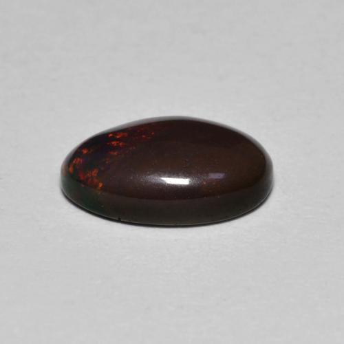 Ópalo chocolate multicolor natural de 0,80 ct, corte óvalo, translúcido