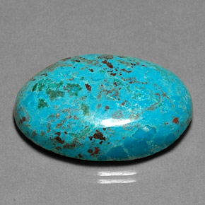 Crisocola multicolor natural de 26,90 ct, corte óvalo, opaco