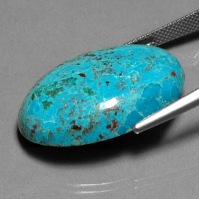 Crisocola multicolor natural de 26,90 ct, corte óvalo, opaco